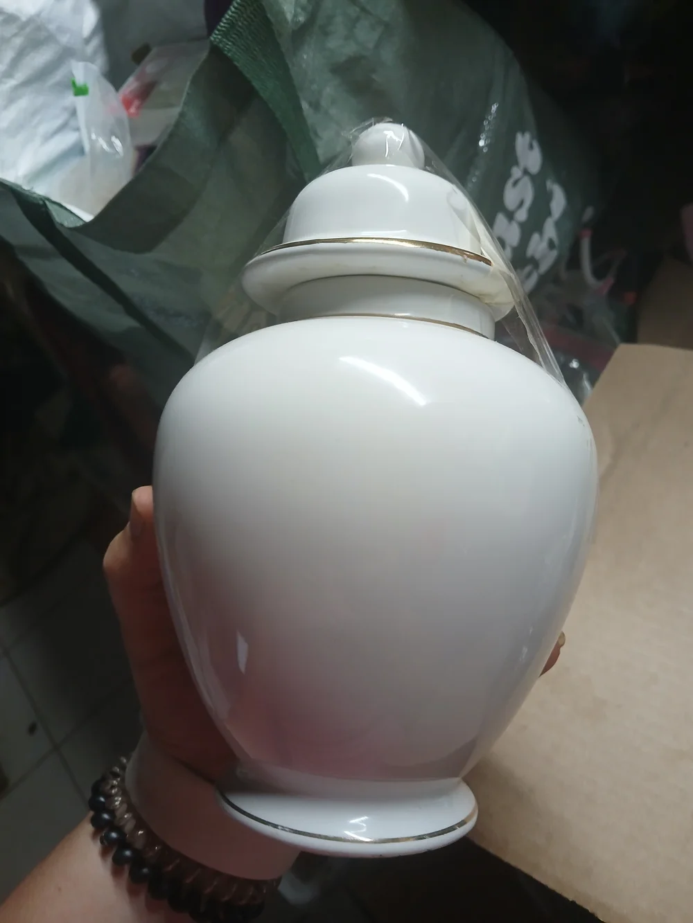 vintage Japanese white porcelain ginger jar featuring a metallic inlaid medallio